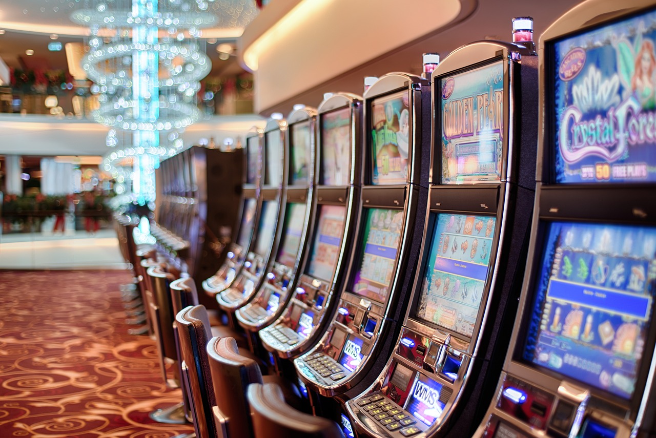 A close up shot of slot machines in a gaming arcade
