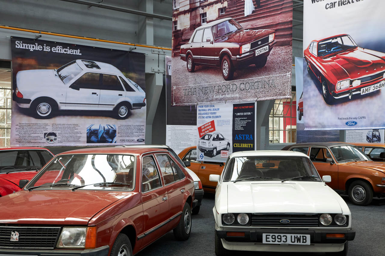Old cars arranged next to each other at an exhibition