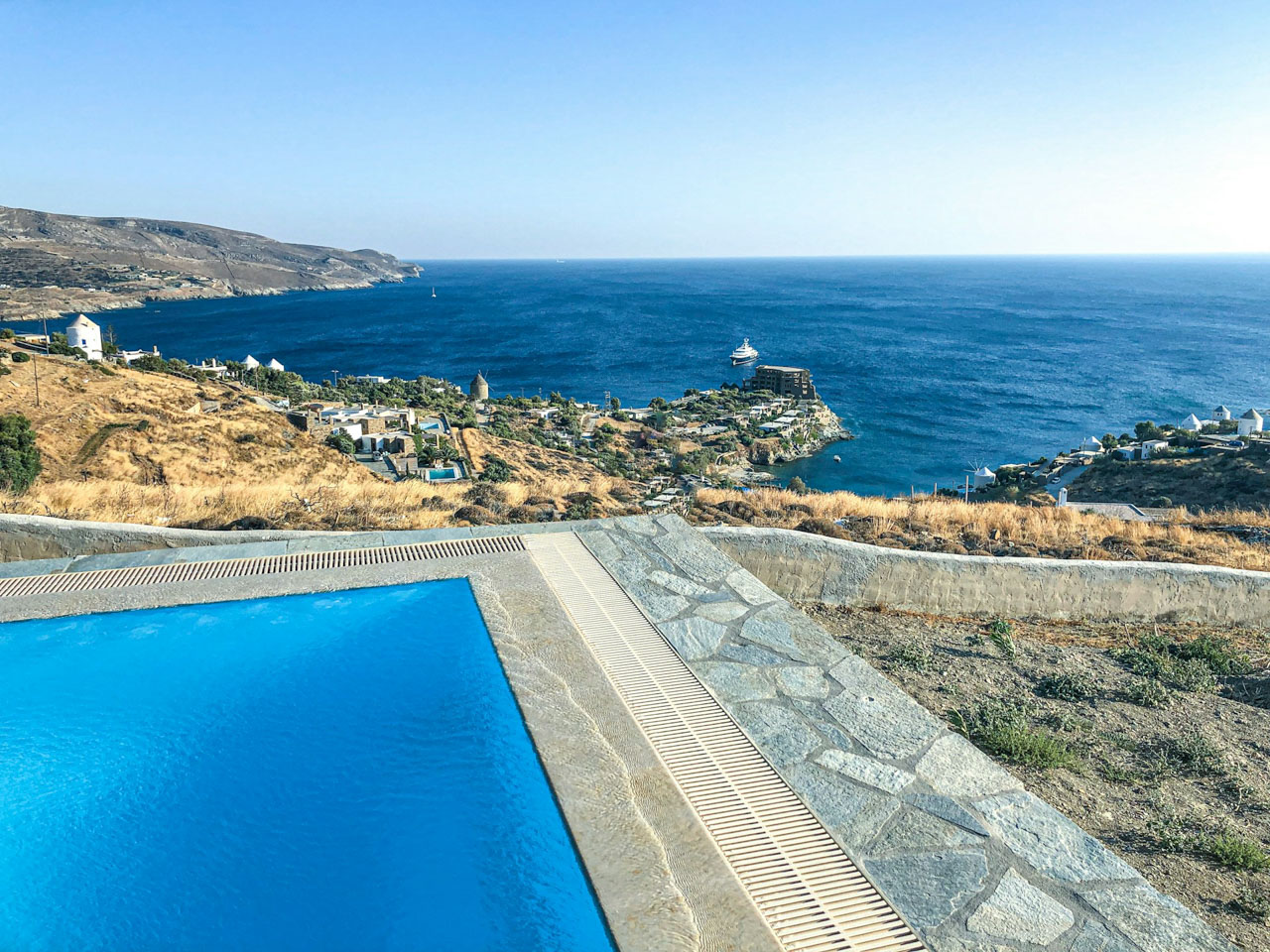 A view looking out over a swimming pool in Kea Island, Greece