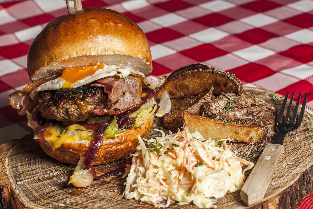 A typical American-style burger with wedges and slaw
