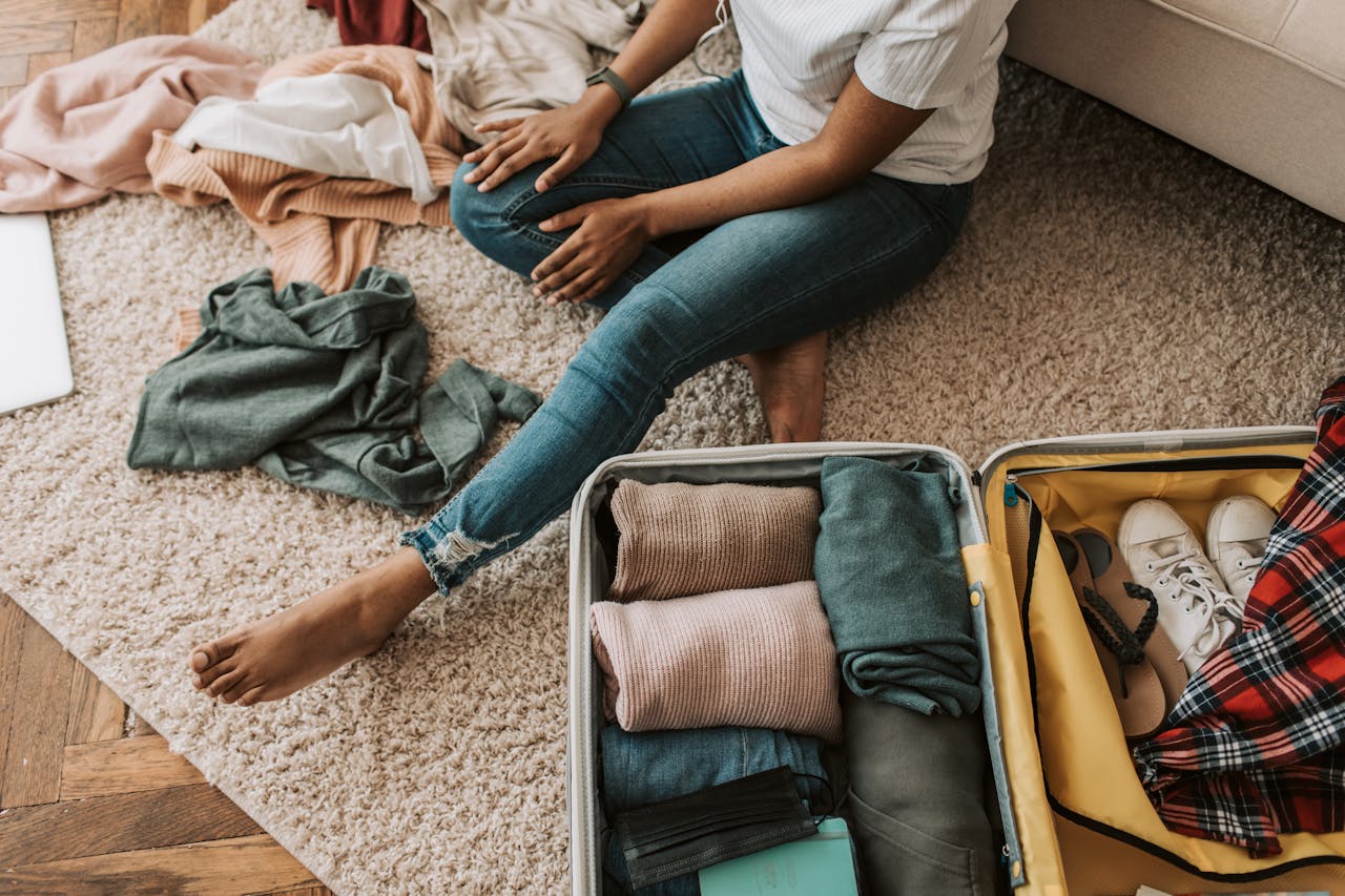 A woman packing a suitcase