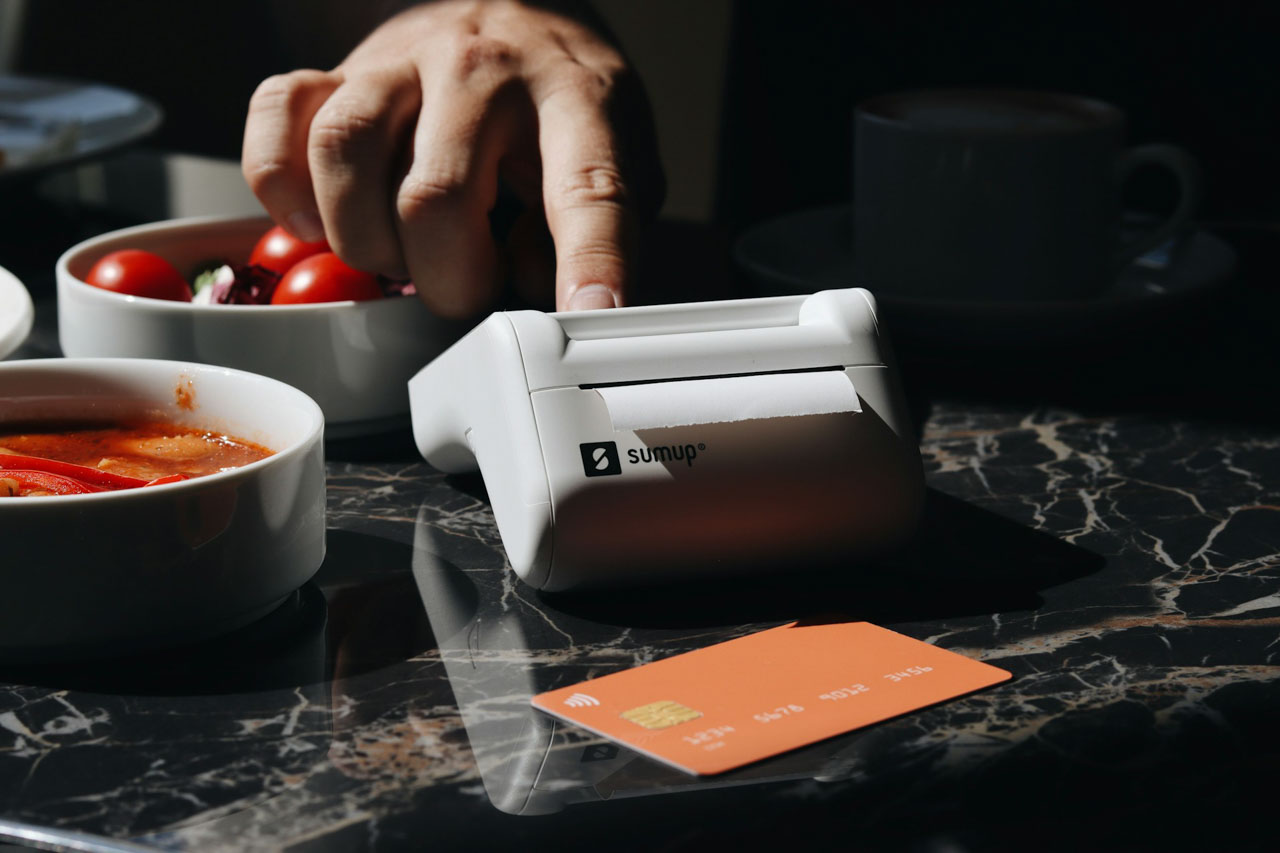 A Sum Up machine being used in a restaurant