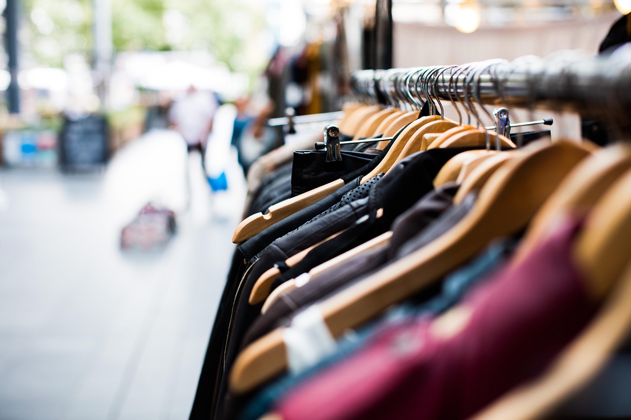 Clothes hanging on a rail in a shop