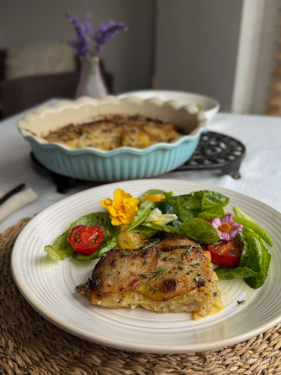 Welsh onion cake on a plate next to a side salad