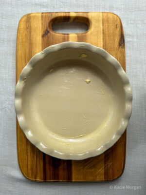 Grease a 23-24 cm pie dish or cake tin with butter